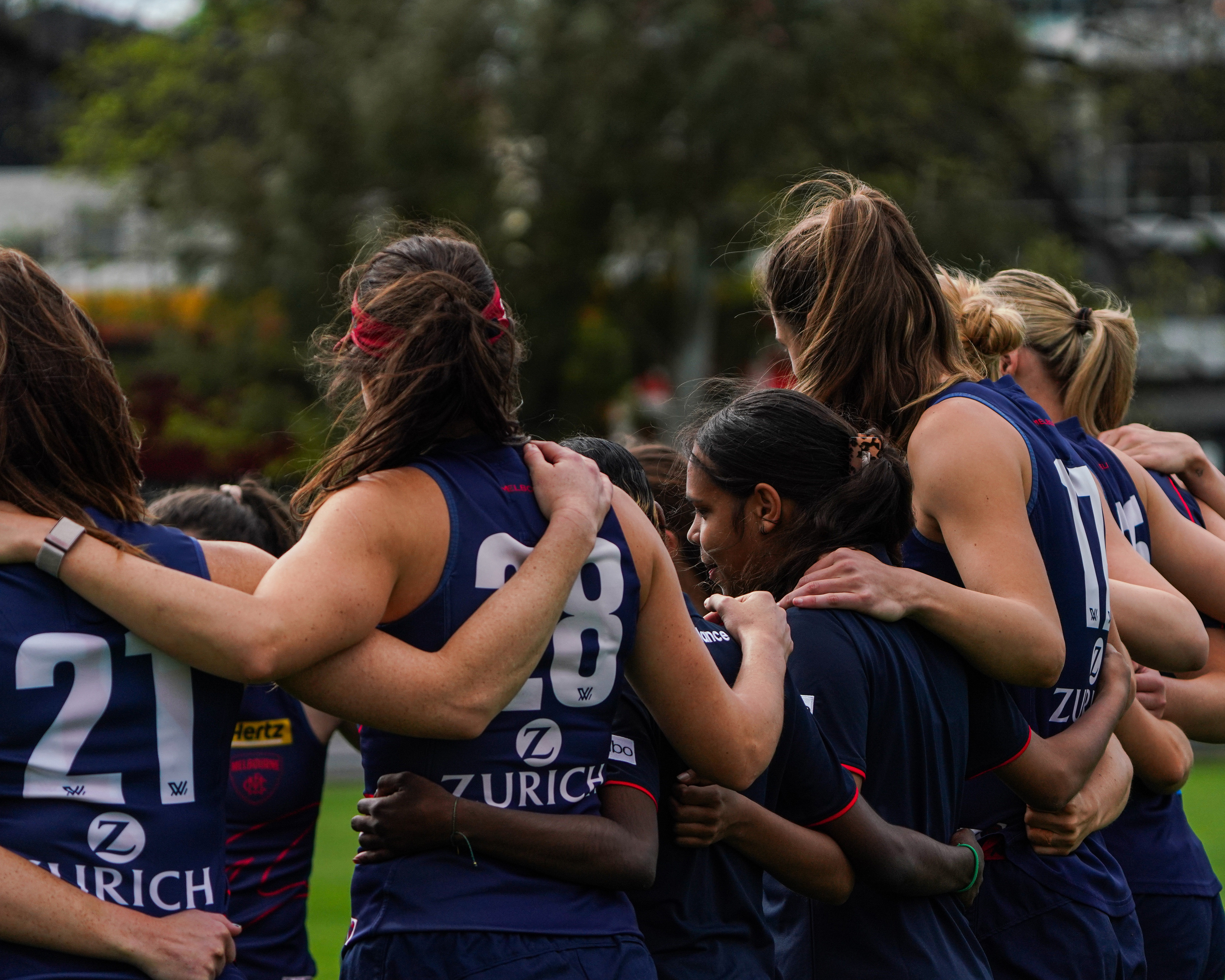 A team huddle at AFLW training.